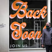 Sign that reads "Back Soon" in the window of a closed shop in Edinburgh city centre, as lockdown measures for mainland Scotland continue picture: PA/Jane Barlow