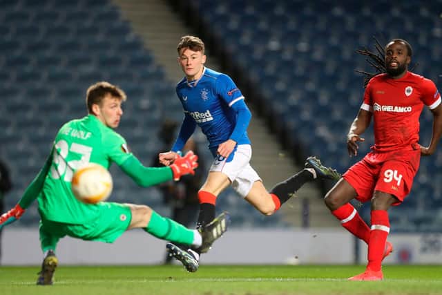 Rangers' Scottish defender Nathan Patterson watches his shot beat Antwerp's Belgian goalkeeper Ortwin De Wolf for their second goal during the UEFA Europa League Round of 32, 2nd leg  match (Photo by RUSSELL CHEYNE/POOL/AFP via Getty Images)