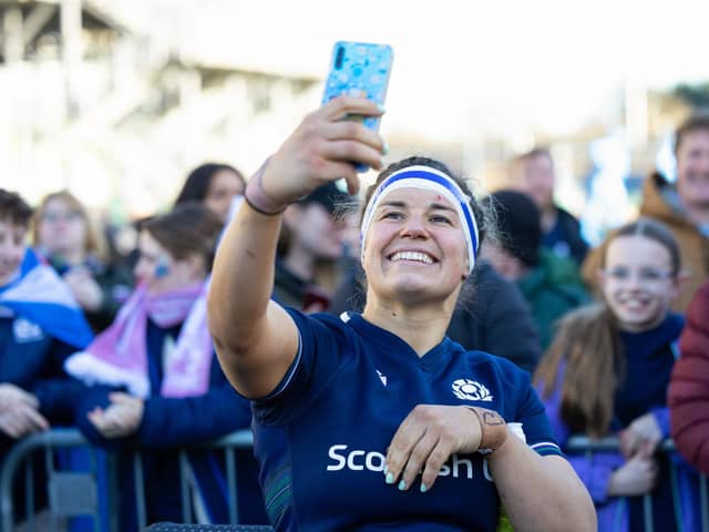 Scotland's captain Rachel Malcolm takes a selfie with young fans at the Guinness Women's Six Nations match against France at Hive Stadium.  (Photo by Ross Parker / SNS Group)