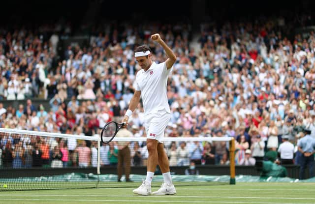 Roger Federer celebrates his Centre Court victory over Cameron Norrie