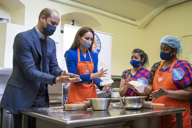 Prince William and Kate prepare meals with representatives of Sikh Sanjog, a Sikh community group, which will be distributed to vulnerable families across Edinburgh, in the cafe kitchen at the Palace of Holyroodhouse, Edinburgh, in May (Picture: Jane Barlow/PA)