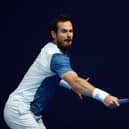 Andy Murray plays a backhand against Kyle Edmund at the Schroders Battle of the Brits event at Roehampton.