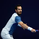 Andy Murray plays a backhand against Kyle Edmund at the Schroders Battle of the Brits event at Roehampton.