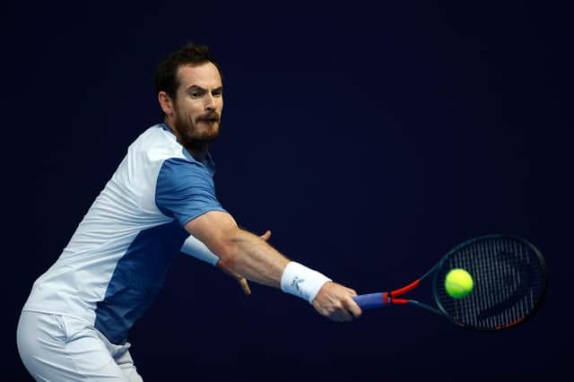 Andy Murray plays a backhand against Kyle Edmund at the Schroders Battle of the Brits event at Roehampton.