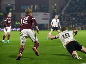 Aberdeen's Lewis Ferguson goes down inside the box and wins the penalty which upset Hearts boss Robbie Neilson. (Photo by Bruce White / SNS Group)