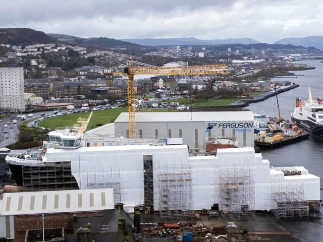 Glen Rosa encased in scaffolding with Glen Sannox docked behind it at the Ferguson Marine shipyard in Port Glasgow last week. (Photo by John Devlin/The Scotsman)