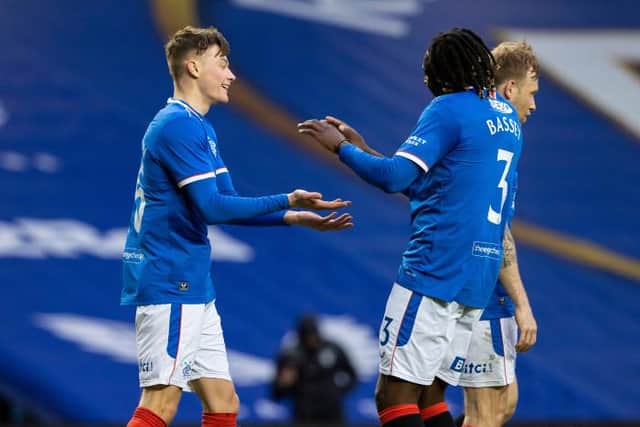 Rangers' Nathan Patterson (L) celebrates making it 4-0 with Calvin Bassey during a Scottish Cup Third Round tie between Rangers and Cove Rangers at Ibrox Stadium, on April 04, 2021, in Glasgow, Scotland. (Photo by Alan Harvey / SNS Group)