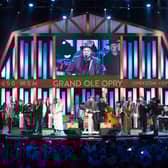 A performance on stage at the Grand Ole Opry House which hosts a live radio show every Saturday.
