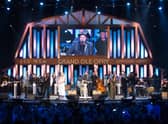 A performance on stage at the Grand Ole Opry House which hosts a live radio show every Saturday.