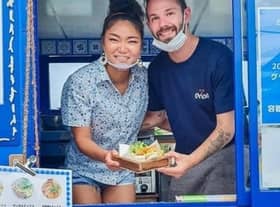 Samwell Galbraith and his wife, Kumi, in their Bonnie Blue van in Japan. PIC: SWNS.
