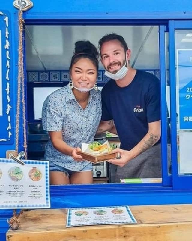 Samwell Galbraith and his wife, Kumi, in their Bonnie Blue van in Japan. PIC: SWNS.