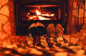 A review is to be carried out into the ban on wood burning stoves in Scotland.