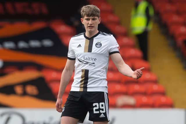 20-year-old Aberdeen defender Jack MacKenzie will hope to follow in the footsteps of Andrew Considine after making his debut in the 1-0 defeat to Dundee United on Saturday (Photo by Craig Foy / SNS Group)