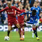 Rangers' Fashion Sakala competes with Liverpool's Fabinho during their match at Ibrox.