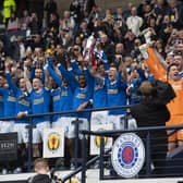 The triumphant Rangers team celebrate winning the Scottish Cup back in May.