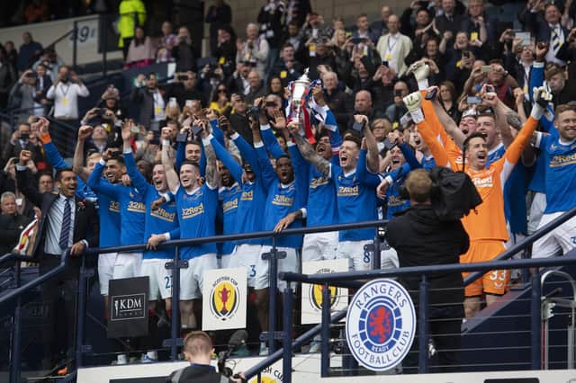 The triumphant Rangers team celebrate winning the Scottish Cup back in May.