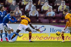 A crowd of cardboard cut-outs watches St Johnstone's David Wotherspoon take a shot during a Betfred Cup match against Motherwell (Picture: Ross MacDonald/SNS Group)