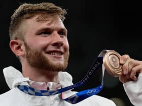 Britain's Josh Kerr with his bronze medal on the podium after the men's 1500m event during the Tokyo 2020 Olympic. Picture: AFP via Getty Images