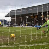 Fashion Sakala scores Rangers' third goal at Dens Park.