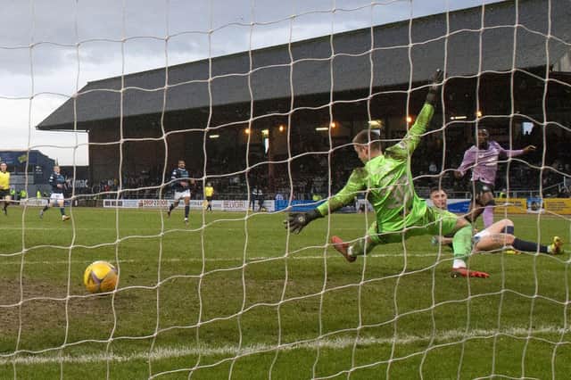 Fashion Sakala scores Rangers' third goal at Dens Park.