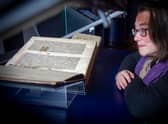 Head of rare books Helen Vincent with the National Library's copy of the Gutenberg Bible, which is going on display in its new Treasures gallery. Picture: Neil Hanna