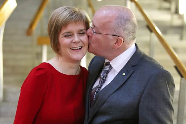 File photo dated 19/11/14 of the then SNP leader Nicola Sturgeon is given a kiss by her husband Peter Murrell at the Scottish Parliament in Edinburgh, after she was voted in as First Minister of Scotland. Former first minister of Scotland Nicola Sturgeon and former SNP chief executive Peter Murrell have "decided to end" their marriage, she said in a post on social media. Issue date: Monday January 13, 2025.
