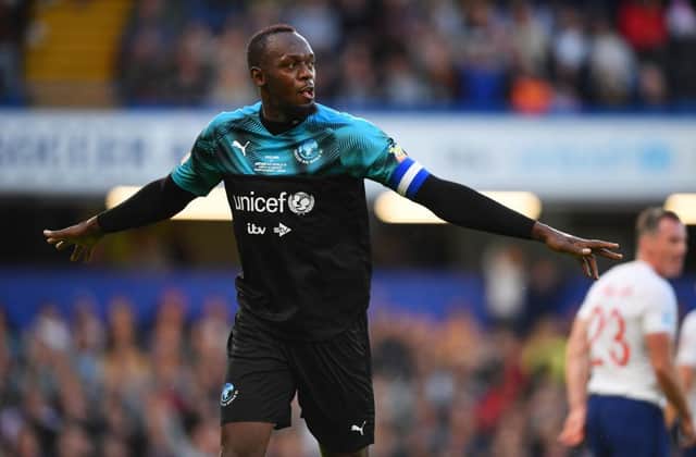 Usain Bolt of Soccer Aid World XI celebrates as he scores his team's first goal during the Soccer Aid for UNICEF 2019 match between England and the Soccer Aid World XI at Stamford Bridge. (Photo by Mike Hewitt/Getty Images)