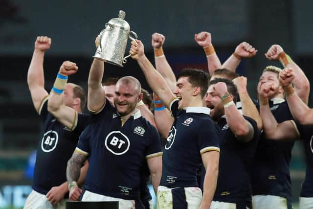 Dave Cherry and Cameron Redpath lift the Calcutta Cup following their Scotland's historic 2021 victory over England, their first at Twickenham for 38 years. (Photo by David Rogers/Getty Images)