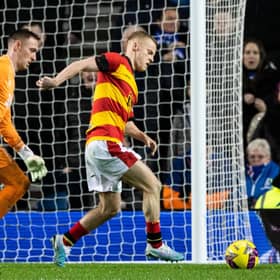Partick's Scott Tiffoney is initially prevented from walking the ball into the net by Rangers goalkeeper Allan McGregor. (Photo by Craig Williamson / SNS Group)