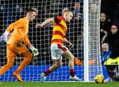 Partick's Scott Tiffoney is initially prevented from walking the ball into the net by Rangers goalkeeper Allan McGregor. (Photo by Craig Williamson / SNS Group)