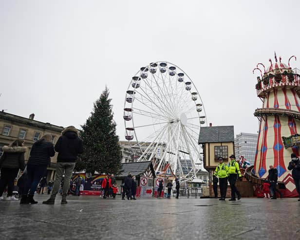 Police officers on patrol at the Christmas market in Nottingham which has been shut temporarily after large crowds gathered at the attraction on Saturday.