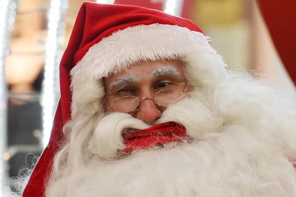 Santa Claus may have to wear a face mask and stay socially distanced but we can still celebrate Christmas (Picture: Bob Edme/AP)