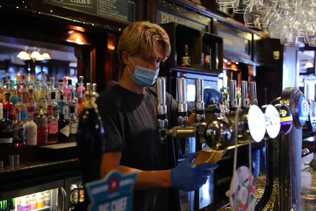 Pubs and restaurants gave PPE to staff and introduced other measures designed to stop the spread of Covid-19 (Picture: Aaron Chown/PA)