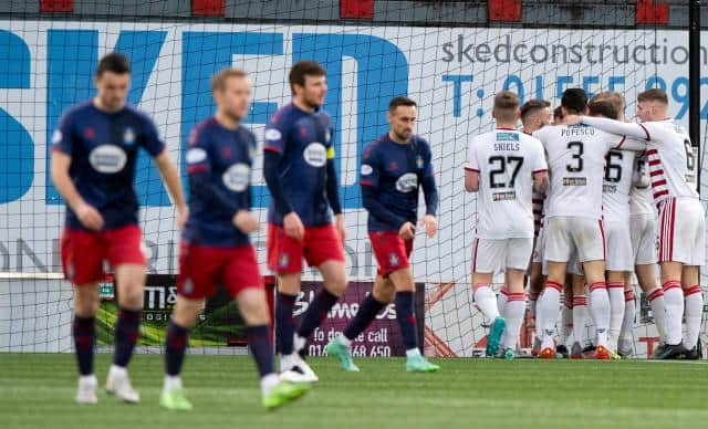 Hamilton players celebrate Ronan Hughes' goal making it 1-0 during a Cinch Championship match between Hamilton and Kilmarnock at the Fountain of Youth Stadium, on December 26, 2021, in Hamilton, Scotland (Photo by Sammy Turner / SNS Group)