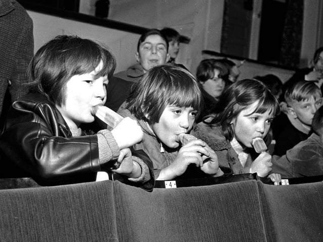 Children eating ice lollies at a special performance of 'The Sound of Music' at Edinburgh's Odeon Cinema in December 1965.