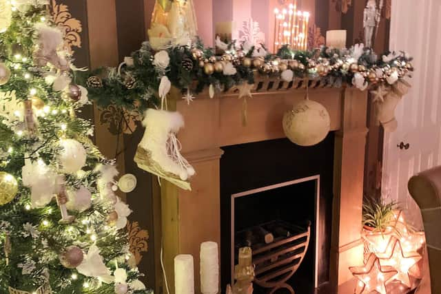 A sparkling snow and ice palette surround the fireplace at Ryseholm in Beith, North Ayrshire, one of the homes visited by the judges in their search for Scotland's Christmas Home of the Year.