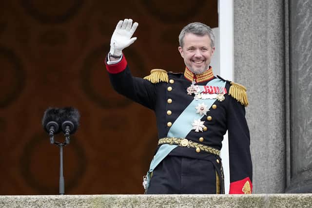 Denmark's King Frederik X waves from the balcony of Christiansborg Palace in Copenhagen, Denmark. Picture: AP Photo/Martin Meissner