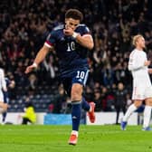 Che Adams celebrates after scoring the second goal in Scotland's 2-0 World Cup qualifying win over Denmark at Hampden in November. (Photo by Ross MacDonald / SNS Group)