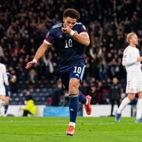 Che Adams celebrates after scoring the second goal in Scotland's 2-0 World Cup qualifying win over Denmark at Hampden in November. (Photo by Ross MacDonald / SNS Group)