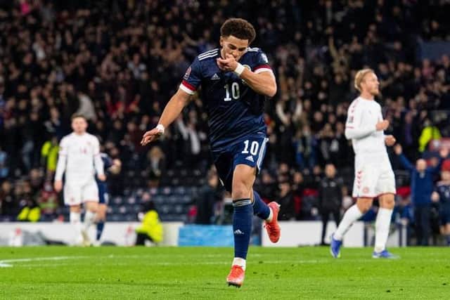 Che Adams celebrates after scoring the second goal in Scotland's 2-0 World Cup qualifying win over Denmark at Hampden in November. (Photo by Ross MacDonald / SNS Group)