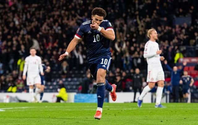 Che Adams celebrates after scoring the second goal in Scotland's 2-0 World Cup qualifying win over Denmark at Hampden in November. (Photo by Ross MacDonald / SNS Group)