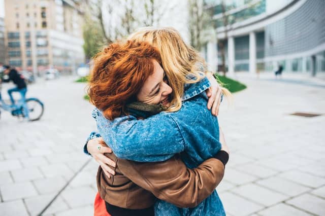 Hugging your friend.
