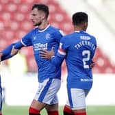 Rangers' Borna Barisic is held back after reacting to Motherwell fans.