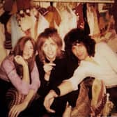 Freddie Mercury (right), Roger Taylor (centre), and Mary Austin in Alan Mair's stall at Kensington Market in 1970.