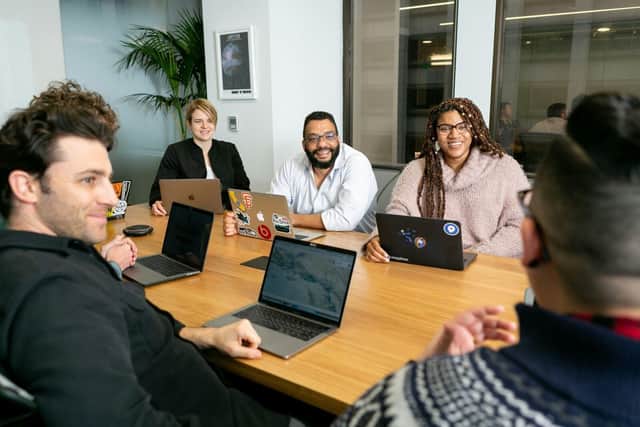 Office workers discussing ideas in a meeting.