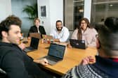 Office workers discussing ideas in a meeting.