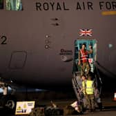 British military personnel depart a C-17 aircraft at RAF Brize Norton, Oxfordshire. The final UK troops and diplomatic staff were airlifted from Kabul on Saturday, drawing to a close Britain's 20-year engagement in Afghanistan and a two-week operation to rescue UK nationals and Afghan allies.