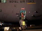 British military personnel depart a C-17 aircraft at RAF Brize Norton, Oxfordshire. The final UK troops and diplomatic staff were airlifted from Kabul on Saturday, drawing to a close Britain's 20-year engagement in Afghanistan and a two-week operation to rescue UK nationals and Afghan allies.
