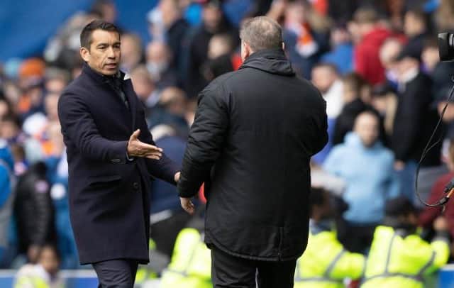 Rangers manager Giovanni van Bronckhorst with his Celtic counterpart Ange Postecoglou after the Scottish champions' lost 2-1 in the Old Firm clash at Ibrox.  (Photo by Craig Williamson / SNS Group)
