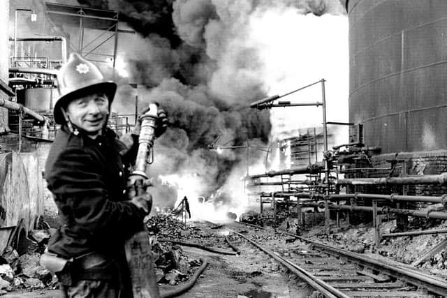 A fireman tackles the blaze at the Scottish Tar Distillers' plant at Camelon in November 1973. Pic: TSPL